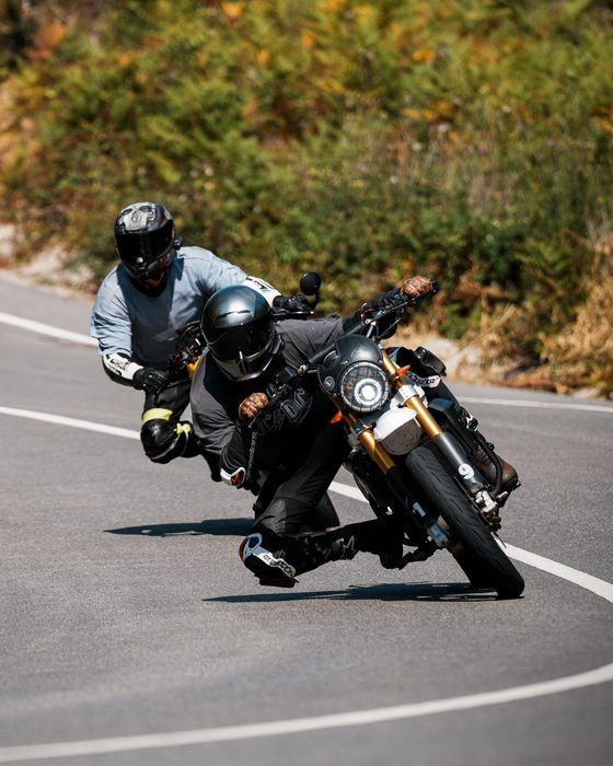 Motorcyclist leaning into a curve, before Color Grade